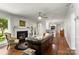 Inviting living room featuring a fireplace, hardwood floors, and natural light at 12602 Angel Oak Dr, Huntersville, NC 28078