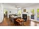 Cozy living room with a fireplace, hardwood floors, and lots of natural light at 12602 Angel Oak Dr, Huntersville, NC 28078