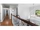 Bright staircase with hardwood floors, natural light, and white decorative molding at 12602 Angel Oak Dr, Huntersville, NC 28078