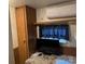 Efficient bedroom featuring a comfortable bed and modern air conditioning unit at 146 Trivette Trl, Mount Gilead, NC 27306
