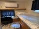 Efficient bedroom design with comfortable bed and modern air conditioning unit at 146 Trivette Trl, Mount Gilead, NC 27306