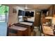 Compact kitchen and dining area, maximizing space with functional layout and adjacent outdoor access at 146 Trivette Trl, Mount Gilead, NC 27306