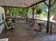 Inviting covered porch with seating provides a relaxing outdoor living space at 146 Trivette Trl, Mount Gilead, NC 27306