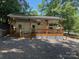 Exterior of RV with covered porch, deck and stone skirting around the base at 148 Trivette Trl, Mount Gilead, NC 27306