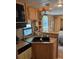 RV kitchen with appliances, sink and countertop at 148 Trivette Trl, Mount Gilead, NC 27306