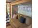 Living room with a couch, pillows and storage space at 148 Trivette Trl, Mount Gilead, NC 27306