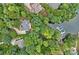 Stunning aerial view of lakefront home, featuring lush landscaping and private boat docks for serene waterfront living at 166 Pinnacle Shores Dr, Mooresville, NC 28117