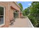 Spacious balcony with outdoor seating, offering views of the lush greenery surrounding the property at 166 Pinnacle Shores Dr, Mooresville, NC 28117