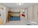 Bedroom with bunkbeds and open doorway to an adjacent room at 166 Pinnacle Shores Dr, Mooresville, NC 28117