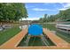 Dock with boats under a sunny sky and trees around the water's edge at 166 Pinnacle Shores Dr, Mooresville, NC 28117