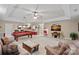 Spacious game room with pool table, large TV, and wet bar for entertaining guests at 166 Pinnacle Shores Dr, Mooresville, NC 28117