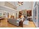 Spacious living room with vaulted ceiling, stone fireplace, and an open view of the staircase at 166 Pinnacle Shores Dr, Mooresville, NC 28117