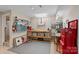 Versatile work room featuring multiple workbenches and ample shelf storage at 166 Pinnacle Shores Dr, Mooresville, NC 28117