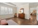Spacious bedroom featuring large windows, hardwood floors, and an inviting sitting area at 17028 River Race Dr, Huntersville, NC 28078