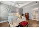 Bedroom with high ceilings, a decorative accent wall, and ensuite bathroom at 17028 River Race Dr, Huntersville, NC 28078