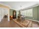 Traditional dining room with oriental rug, shuttered windows, and built-in shelves at 17028 River Race Dr, Huntersville, NC 28078