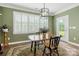 Dining area with shuttered windows, table, and view of outdoors at 17028 River Race Dr, Huntersville, NC 28078