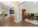 Elegant foyer showcasing hardwood floors, and arched doorway leading to a dining area at 17028 River Race Dr, Huntersville, NC 28078