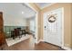 Beautiful foyer with hardwood floors and office space that provide a grand entrance into the home at 17028 River Race Dr, Huntersville, NC 28078