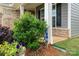 Charming front yard featuring lush landscaping and irrigation system at 17028 River Race Dr, Huntersville, NC 28078