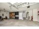 Spacious garage with overhead lighting, custom built-in storage and concrete flooring at 17028 River Race Dr, Huntersville, NC 28078