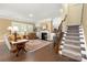 Living room with fireplace, staircase, and comfortable seating area at 17028 River Race Dr, Huntersville, NC 28078