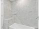 This is a bathroom with marble tile and a tub at 174 Maske Rd, Mount Gilead, NC 27306