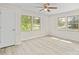 This is a bedroom with hardwood floors, windows, and door at 174 Maske Rd, Mount Gilead, NC 27306