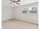 This is a bedroom with hardwood floors and two windows at 174 Maske Rd, Mount Gilead, NC 27306