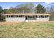 Charming single-story home with a well-maintained yard and freshly painted grey brick facade at 174 Maske Rd, Mount Gilead, NC 27306