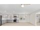 Well-lit kitchen features stainless appliances, gray cabinetry, a window with natural light, and hardwood flooring at 174 Maske Rd, Mount Gilead, NC 27306