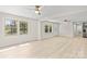 Bright and airy living space with new flooring, adjacent to an open concept kitchen and dining area at 174 Maske Rd, Mount Gilead, NC 27306