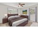 Staged main bedroom with a large window, hardwood floors, and furniture at 174 Maske Rd, Mount Gilead, NC 27306