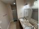 Bathroom features a double sink vanity, shower, and tiled flooring at 190 Watering Trough Rd, Statesville, NC 28677