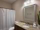 Bathroom features a granite counter and shower with curtain at 190 Watering Trough Rd, Statesville, NC 28677