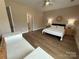 Bedroom with wood-look flooring and neutral-toned walls at 190 Watering Trough Rd, Statesville, NC 28677