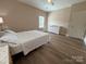 This bedroom features wood-look flooring and bright natural light at 190 Watering Trough Rd, Statesville, NC 28677