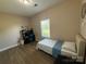 Bedroom features a window, desk, and wall decor at 190 Watering Trough Rd, Statesville, NC 28677