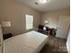 This bedroom features a window and includes space for a desk at 190 Watering Trough Rd, Statesville, NC 28677