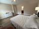 Bedroom featuring wood-look flooring and ensuite bathroom at 190 Watering Trough Rd, Statesville, NC 28677