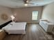 Bedroom featuring wood-look flooring and bright natural light at 190 Watering Trough Rd, Statesville, NC 28677