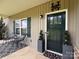 Inviting front porch with stylish seating, decorative plants, and a personalized nameplate at 190 Watering Trough Rd, Statesville, NC 28677
