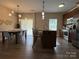 Charming kitchen and dining area with modern lighting, stainless appliances, and open concept layout at 190 Watering Trough Rd, Statesville, NC 28677