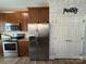 Kitchen with stainless steel refrigerator, granite countertops, and pantry access at 190 Watering Trough Rd, Statesville, NC 28677