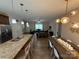 View of open floorplan featuring kitchen, dining area, and living room, perfect for entertaining at 190 Watering Trough Rd, Statesville, NC 28677