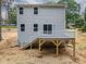 Two-story home with a deck and stairs leading to the backyard at 1941 32Nd Ne St, Hickory, NC 28601