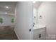 Modern half-bath featuring a sleek vanity, quartz countertop, and black hardware at 1941 32Nd Ne St, Hickory, NC 28601