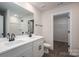 Modern bathroom has a double sink vanity, and shower-tub combo providing a clean, functional design at 1941 32Nd Ne St, Hickory, NC 28601