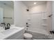 White bathroom features black fixtures, bathtub, and vanity, creating a contemporary and inviting space at 1941 32Nd Ne St, Hickory, NC 28601