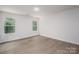 Serene bedroom featuring gray flooring, neutral walls, and lots of natural light from the windows at 1941 32Nd Ne St, Hickory, NC 28601